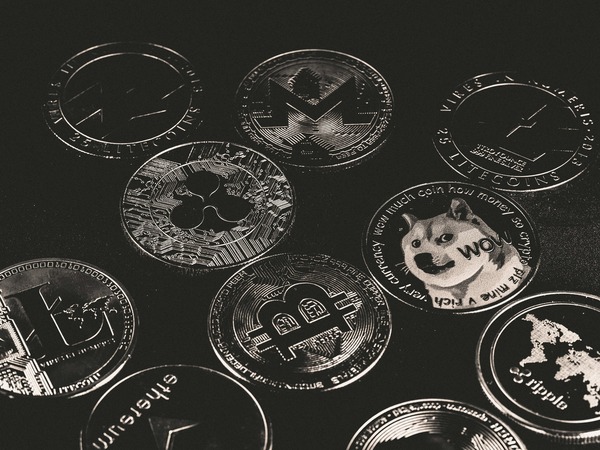 Engraved crypto coins in black and white