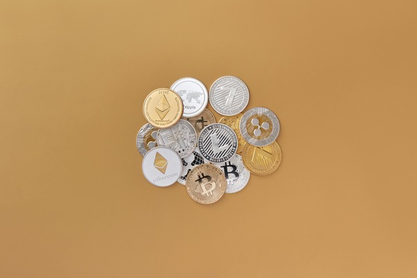Small pile of crypto coins on beige