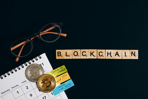 Blockchain letter tiles with a calendar and coins