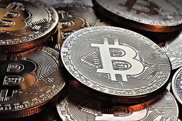 Pile of silver and gold bitcoin coins