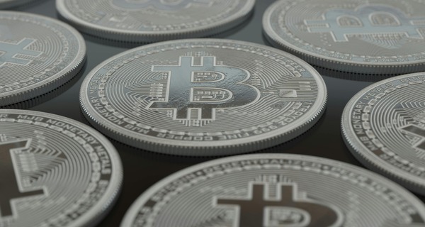 Rows of silver bitcoin coins