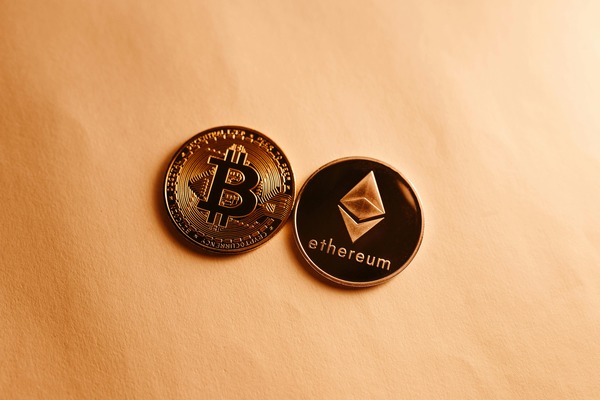 Bitcoin and ethereum coins on beige