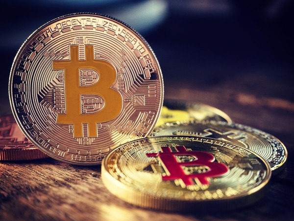 Bitcoin coins on a wooden surface