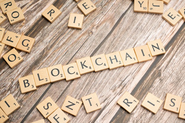 Blockchain spelled with wooden tiles