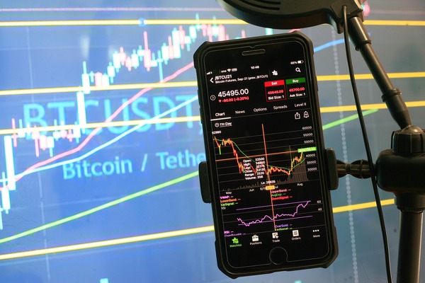 Phone with a bitcoin to tether chart