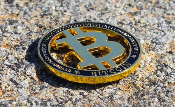 Bitcoin coin lying on granite