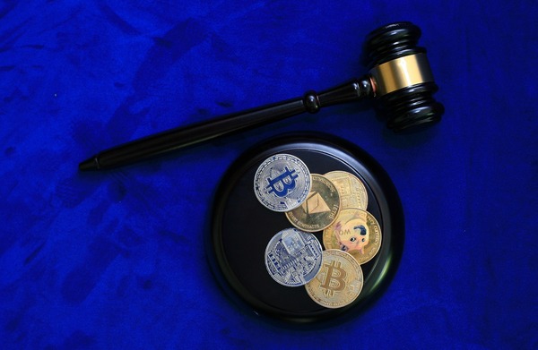 Judge gavel above crypto coins