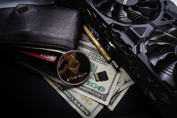 Wallet with an ethereum coin and dollar bills