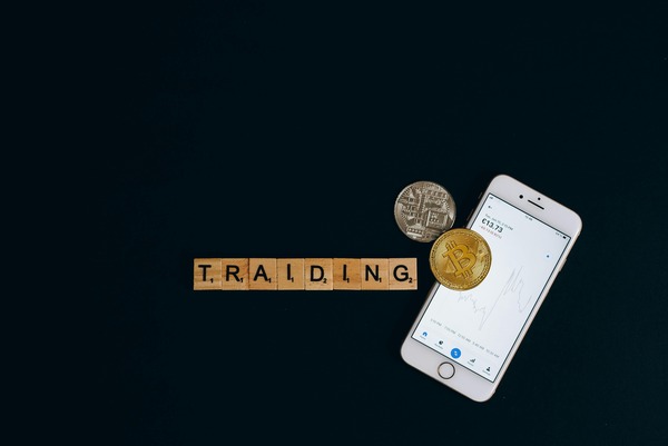 Trading letter tiles with a phone and a coin